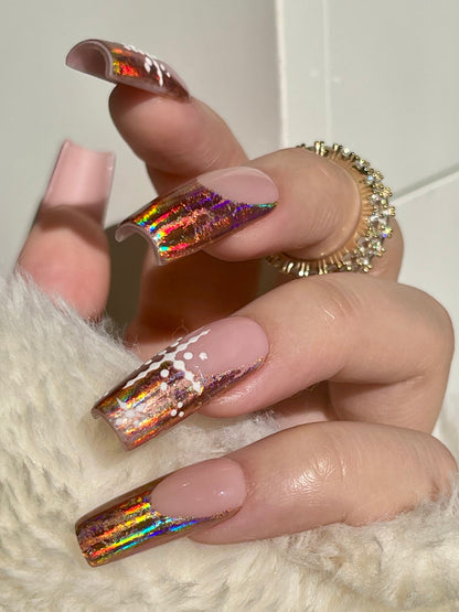 Hand with iridescent nail polish on a white background